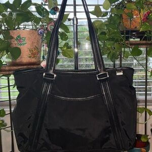 TUMI BLACK NYLON BAG LEATHER TRIM 2 STRAPS ZIP TOP, ZIP & SLIP EXTERIOR POCKET.